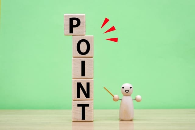 POINTの文字を指す人形